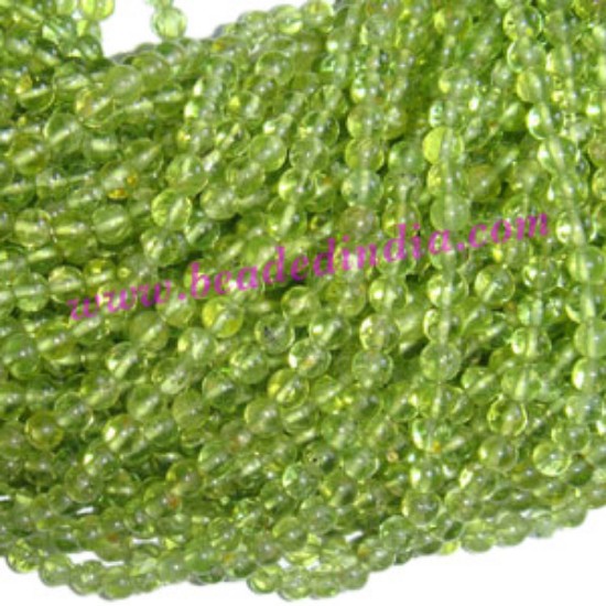 Picture of Peridot 4mm round semi precious gemstone beads.